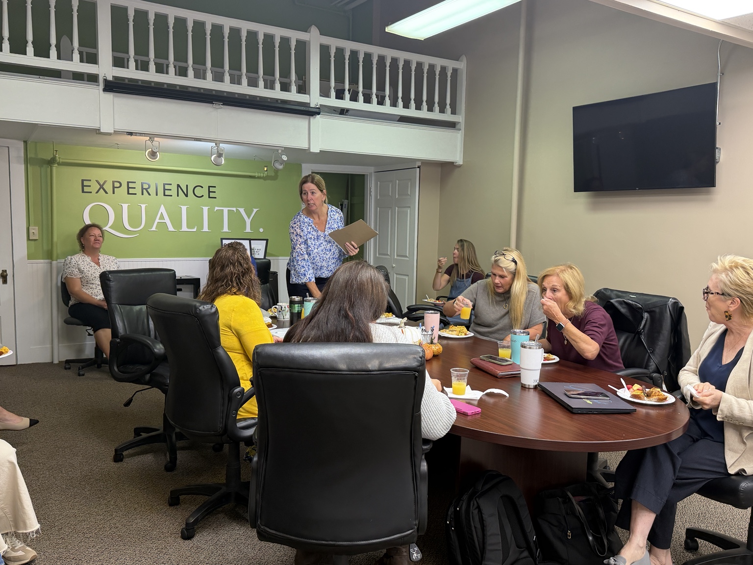 Kathy Ahlin leading a discussion with Concord and Meredith real estate agents during the Harvest Breakfast.